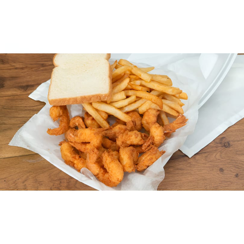 Fried shrimp and french fries with a slice of white bread in a takeout container.